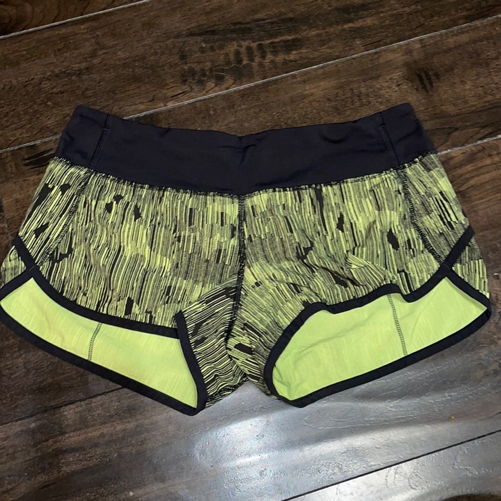 Black and yellow Lululemon Speed Shorts - Picture 1 of 4